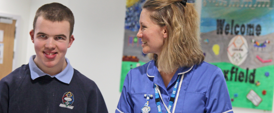 Specialist School Nurse smiling at pupil from Foxfield School