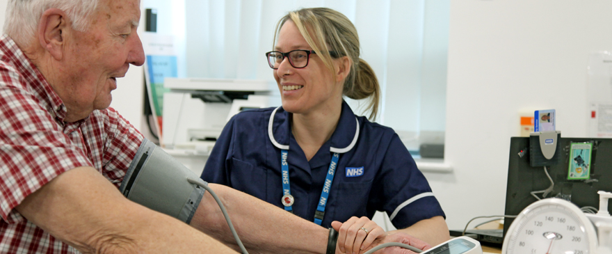 Nurse taking a patient's blood pressure