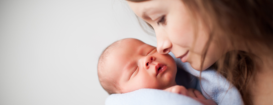 Mother close up with newborn baby