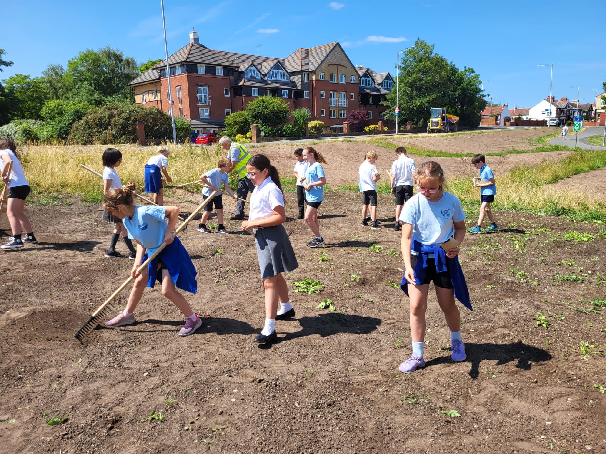 Children from local primary school sowing seeds