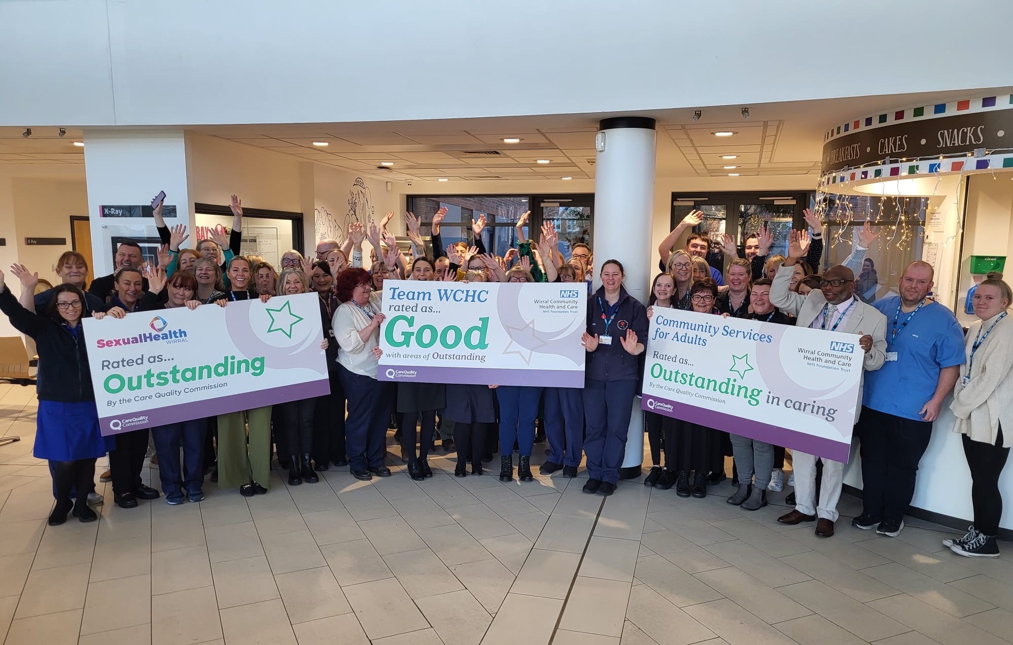 Group of Trust staff celebrating the Good CQC rating.