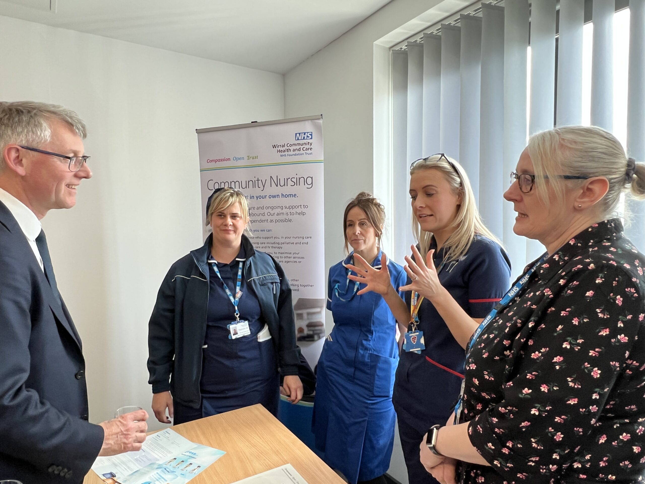 Sir Julian Hartley talking to community nurses