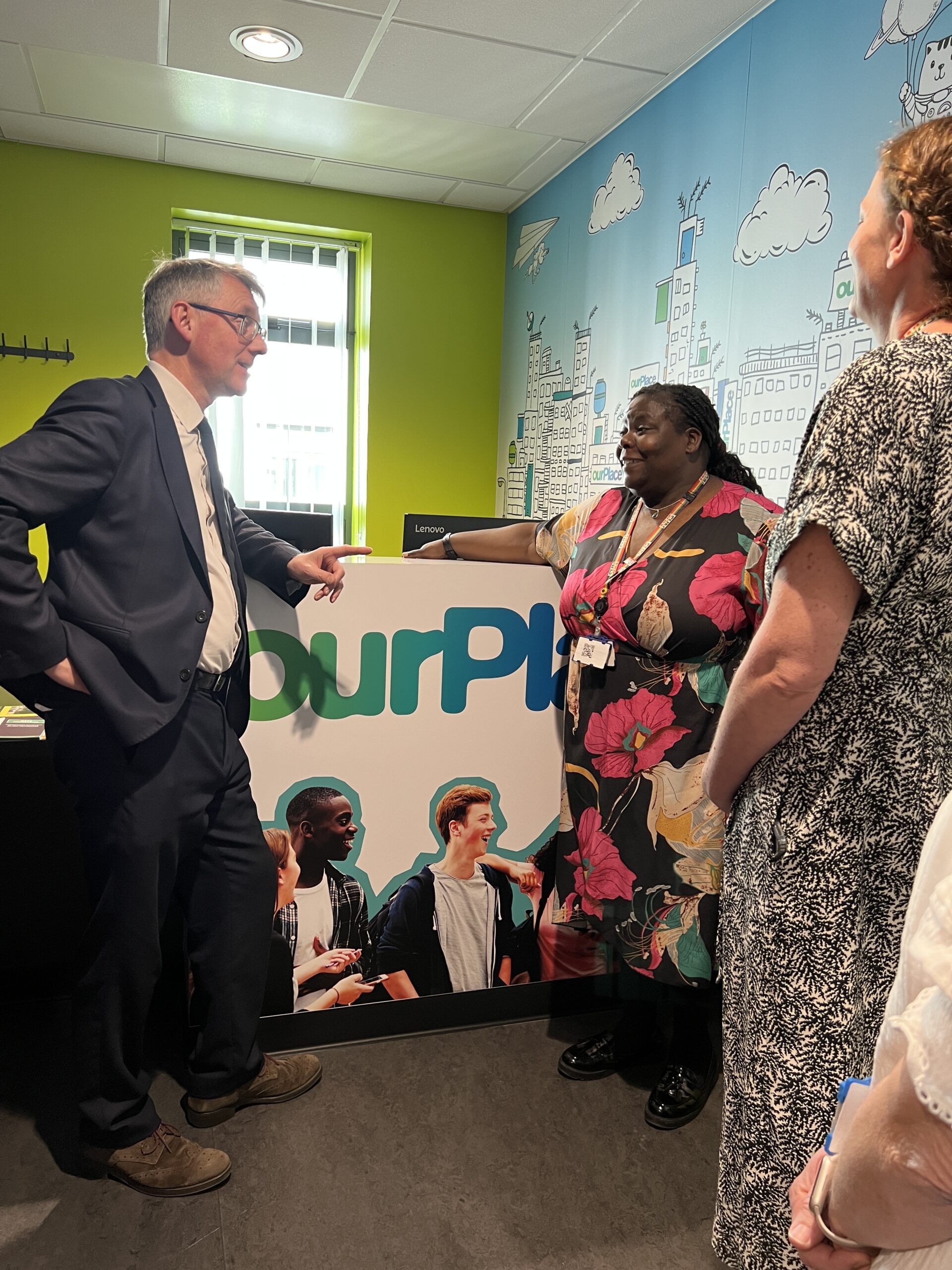 Sir Julian Hartley in the ourPlace reception with Service Lead and Service Development Coordinator