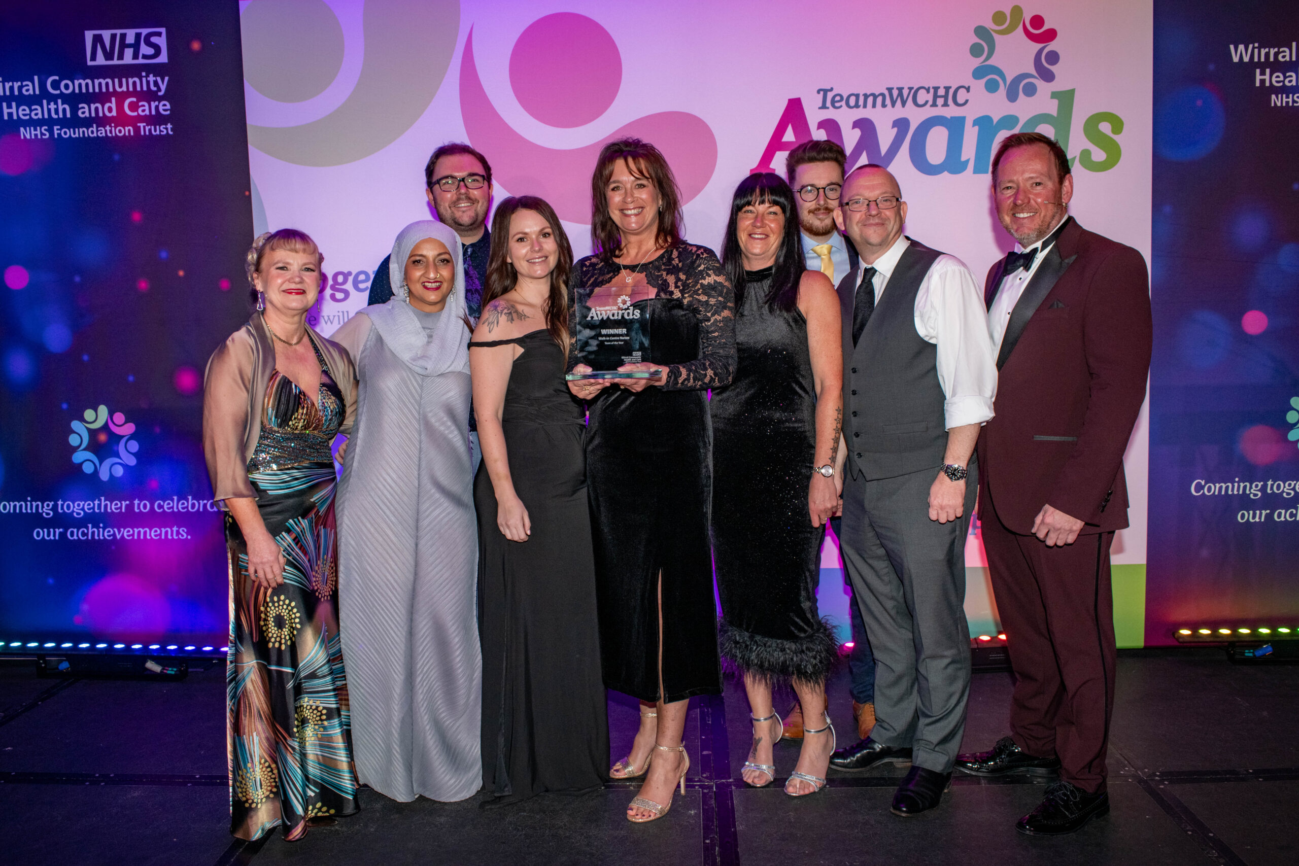 Staff accepting award on stage