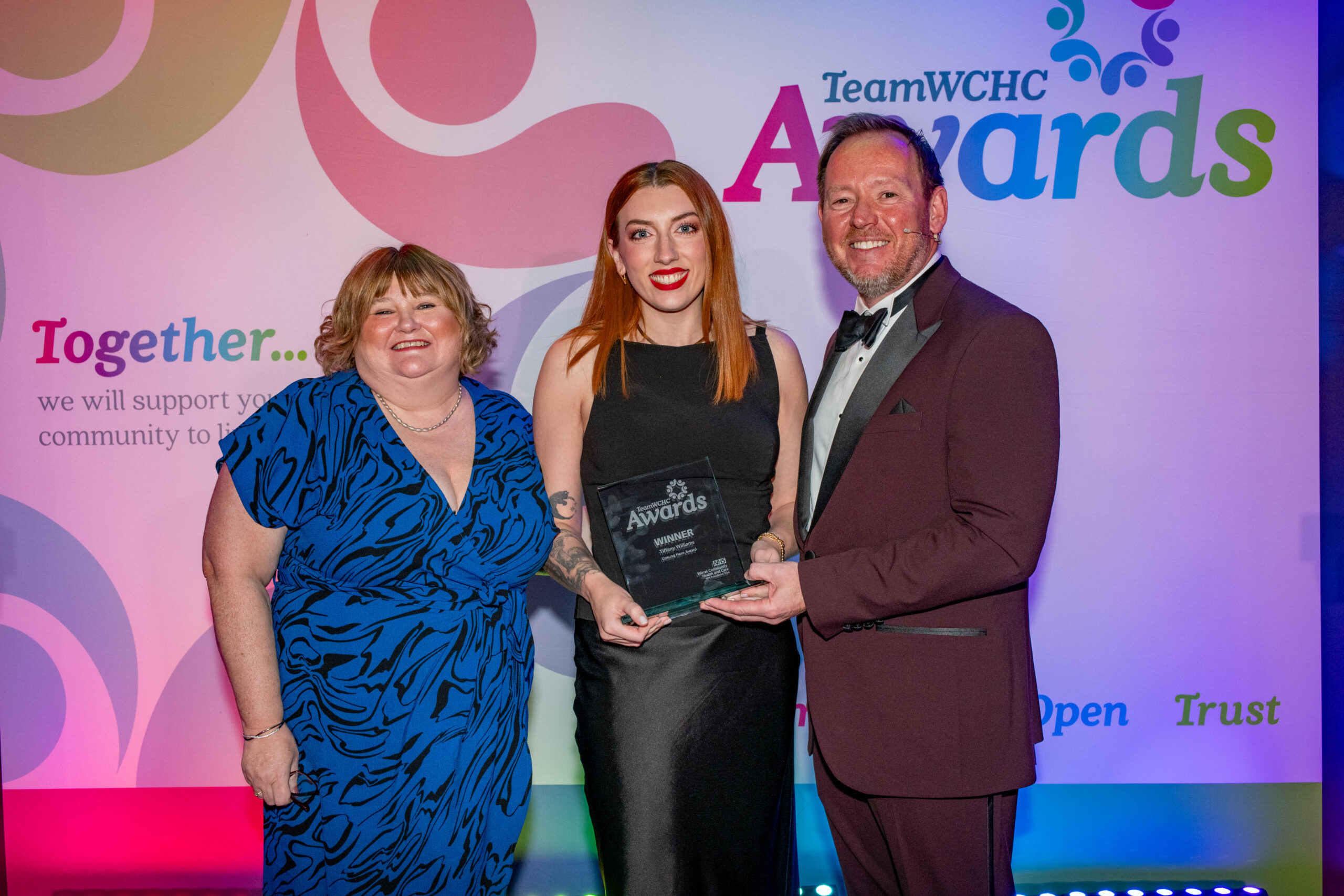Staff accepting award on stage
