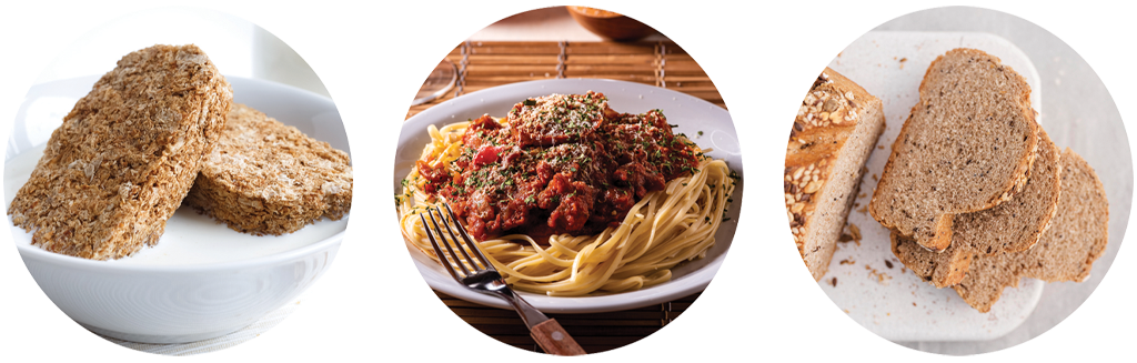Image includes a bowl of Wheetabix with milk, spaghetti bolognese and sliced brown bread.