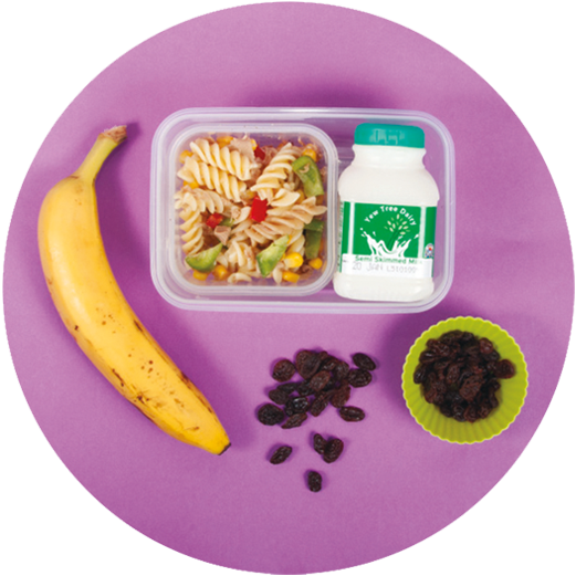 Image of a child's packed lunch which includes a small tub of tuna, sweetcorn and pepper pasta, small bottle of milk, one heaped tablespoon of raisins and a carton of semi-skimmed milk.