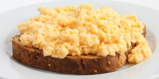 Image of scrambled egg on toast.
