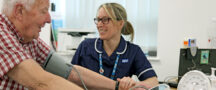 Nurse taking a patient's blood pressure