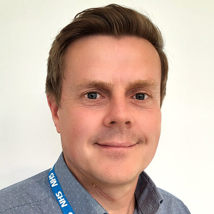 Man wearing NHS lanyard