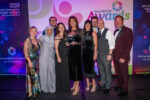 Staff accepting award on stage