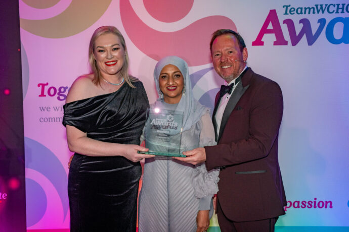 Staff accepting award on stage