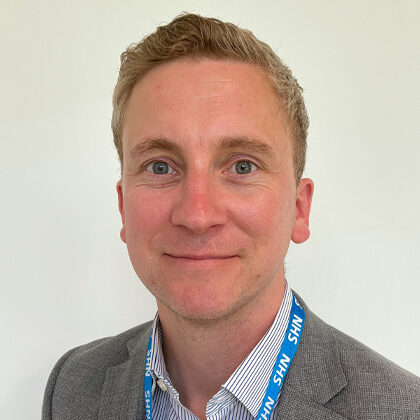 Picture of man smiling at camera.