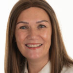 Portrait photograph of Ali Hughes