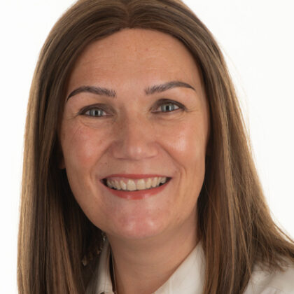 Portrait photograph of Ali Hughes