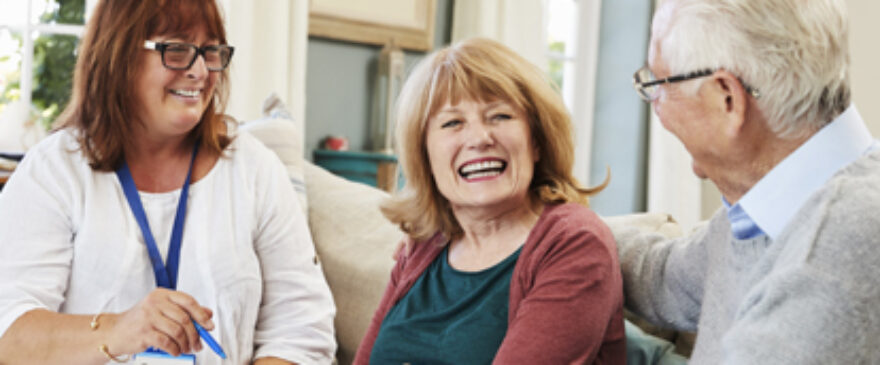 Clinician talking with patients in their home