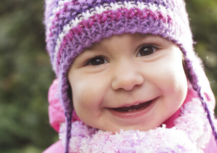 Young child wearing winter clothing