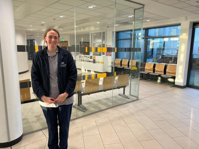 Student in front of Community Cardiology waiting area