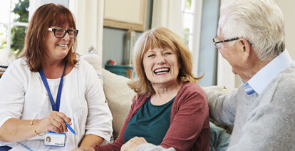 Clinician talking with patients in their home